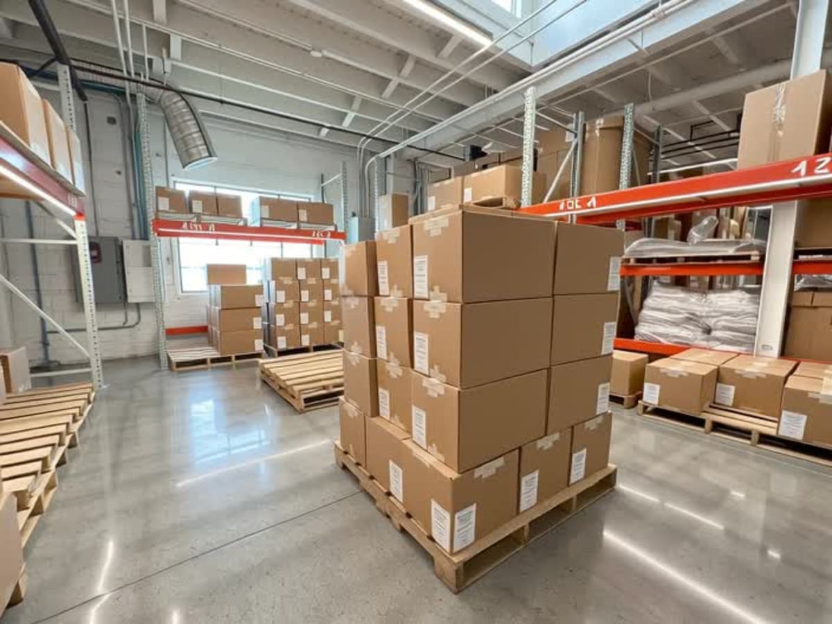 Shelves of boxed hardware and parts kept on hand at Security Molding