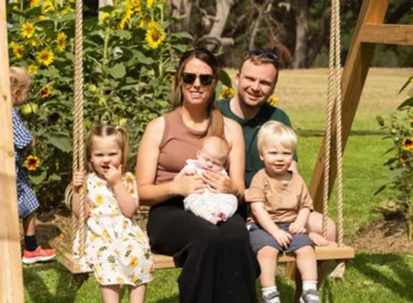 A family group enjoying the sunflower garden together at Mornington Green.