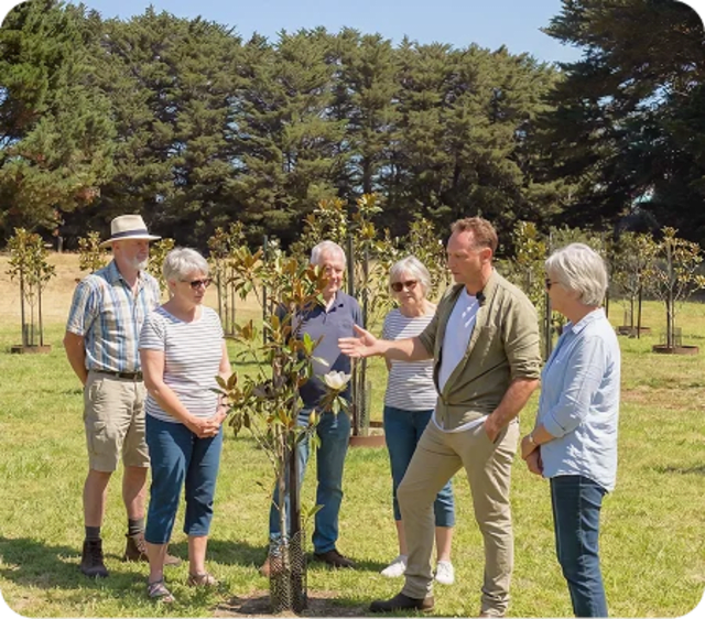 Visitors at Mornington Green Living Legacy Gardens during an open day on the lawn.