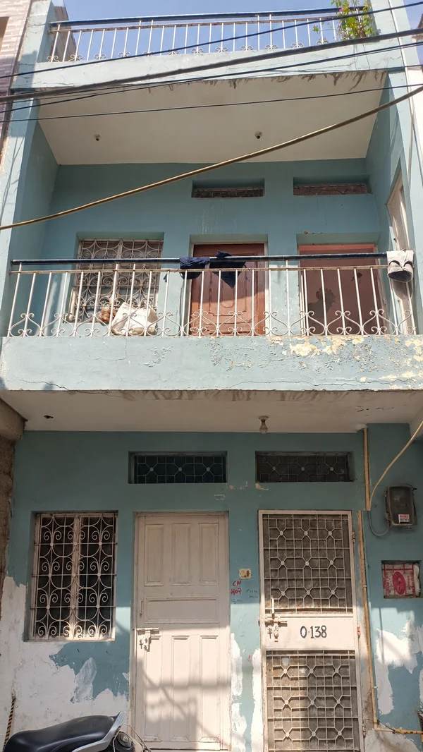 Weathered Teal Urban House Facade.png