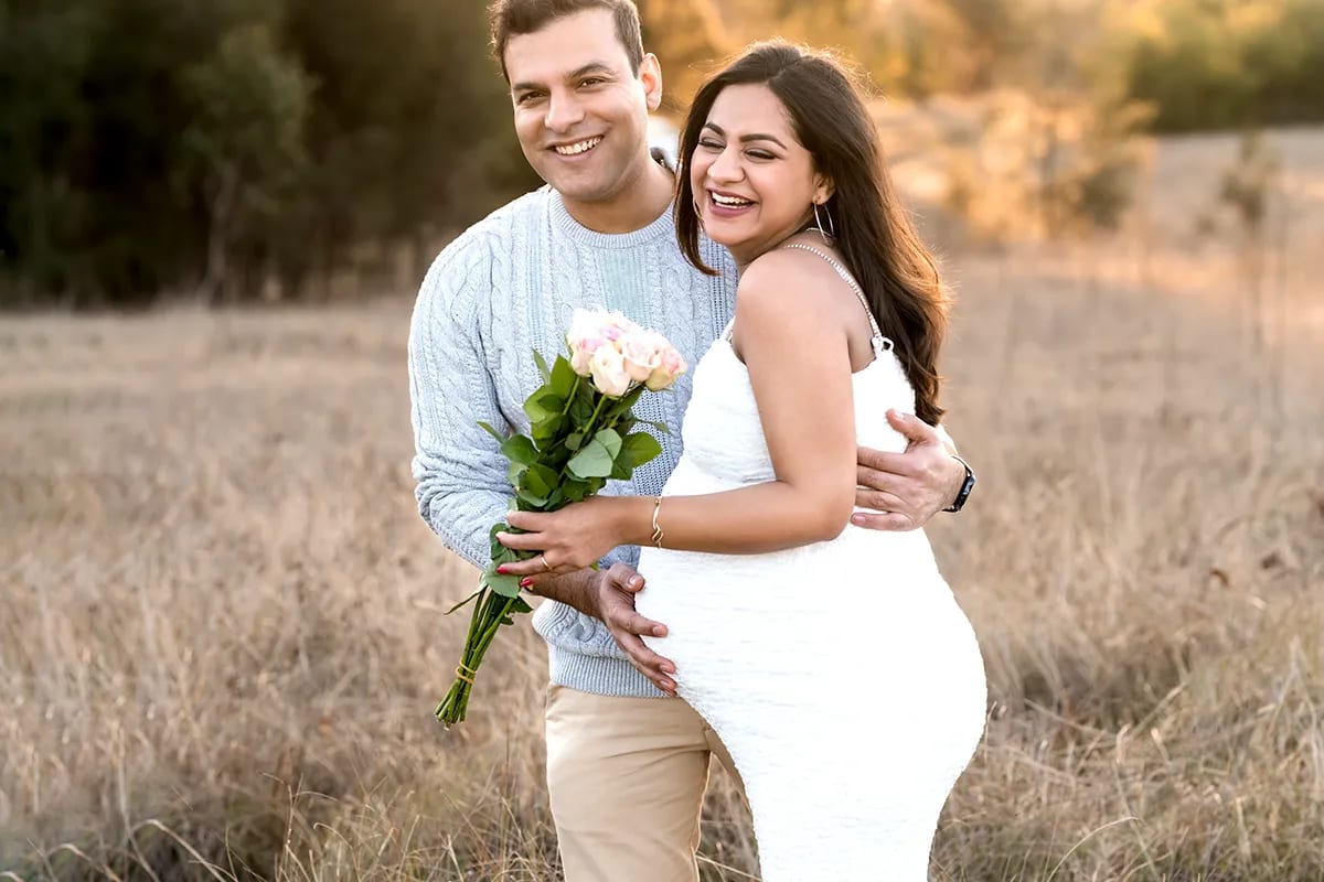 Maternity couple embracing baby bump golden sunset portrait Hills District — Shekhar Jay Photography