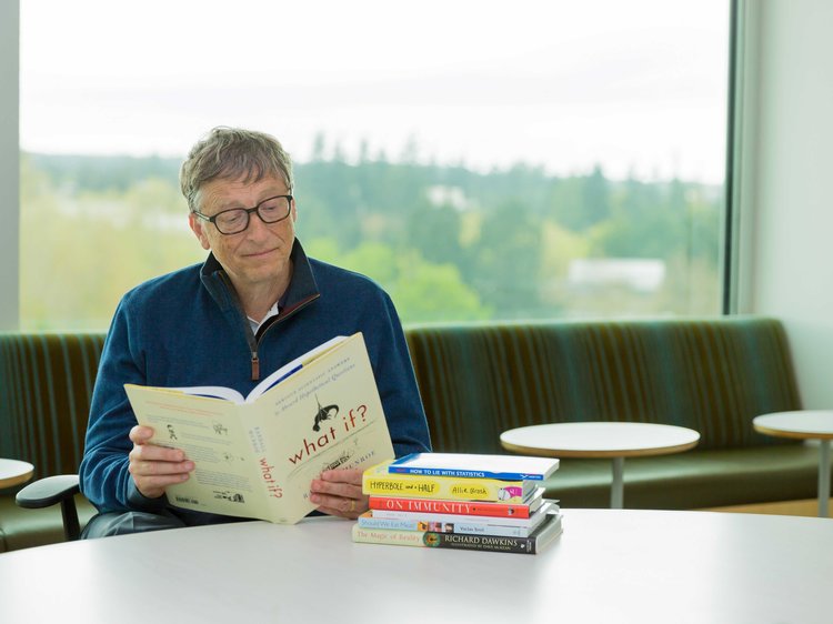 bill gates reading a book
