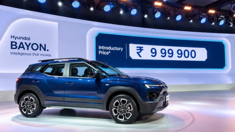 Front three-quarter view of the newly launched Hyundai Bayon crossover displaying its parametric grille and LED DRLs on Indian road