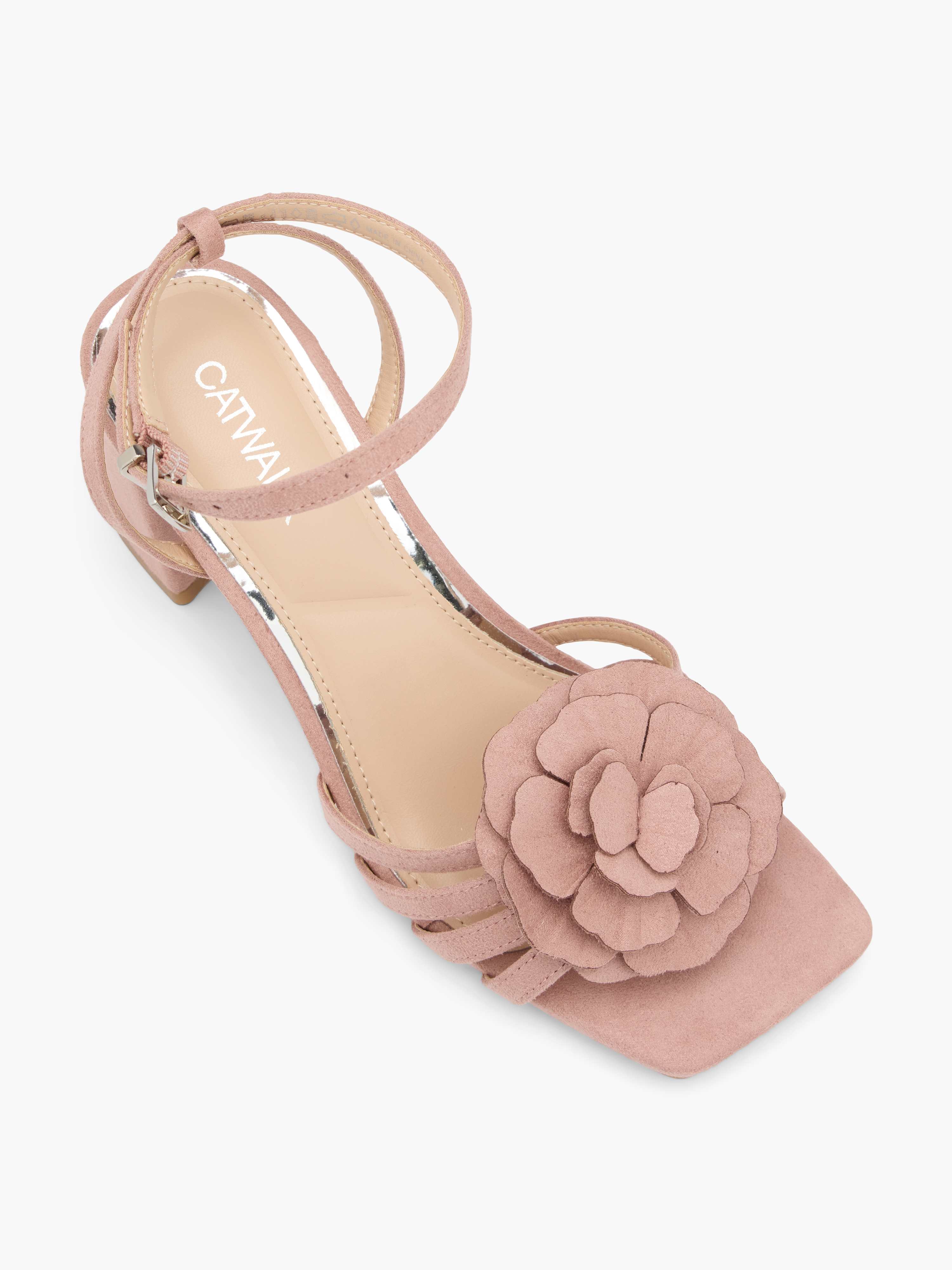 Rosé-farbener Pumps mit aufgesetzter Blume