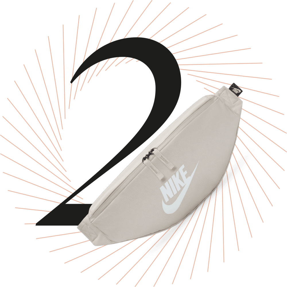 Hellgraue Bauchtasche der Marke Nike, schwarze Ziffer 2 im Hintergrund