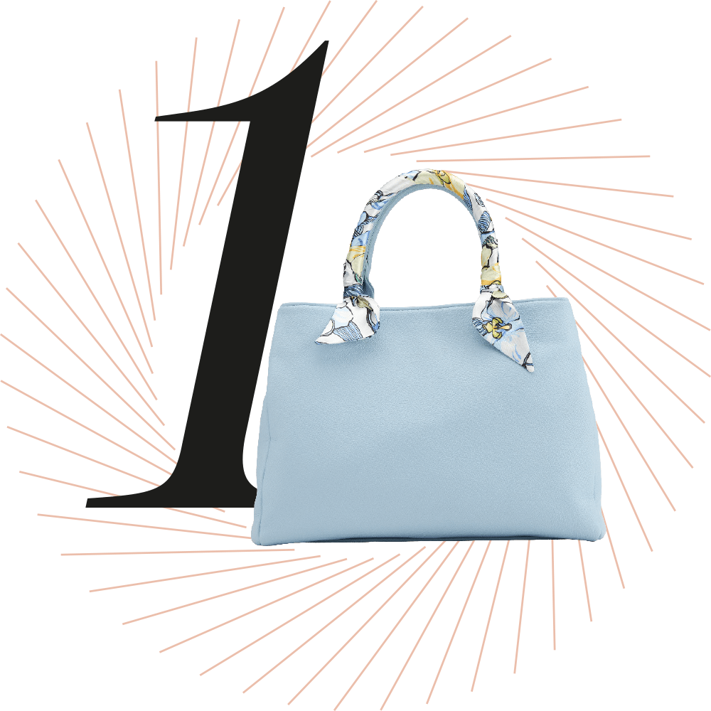 Hellblaue Shopper-Bag, schwarze Ziffer 1 im Hintergrund