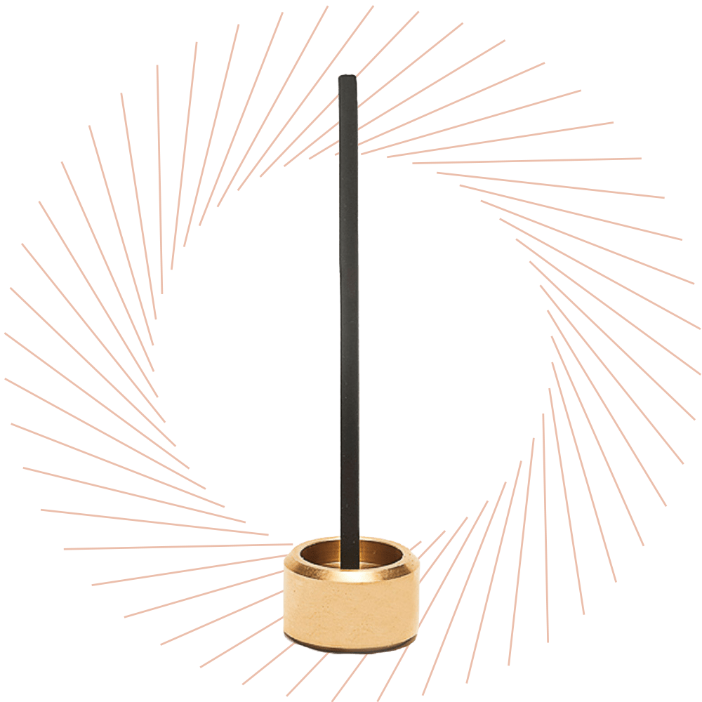 Goldener Räucherstäbchenhalter aus Messing mit schwarzem Räucherstäbchen