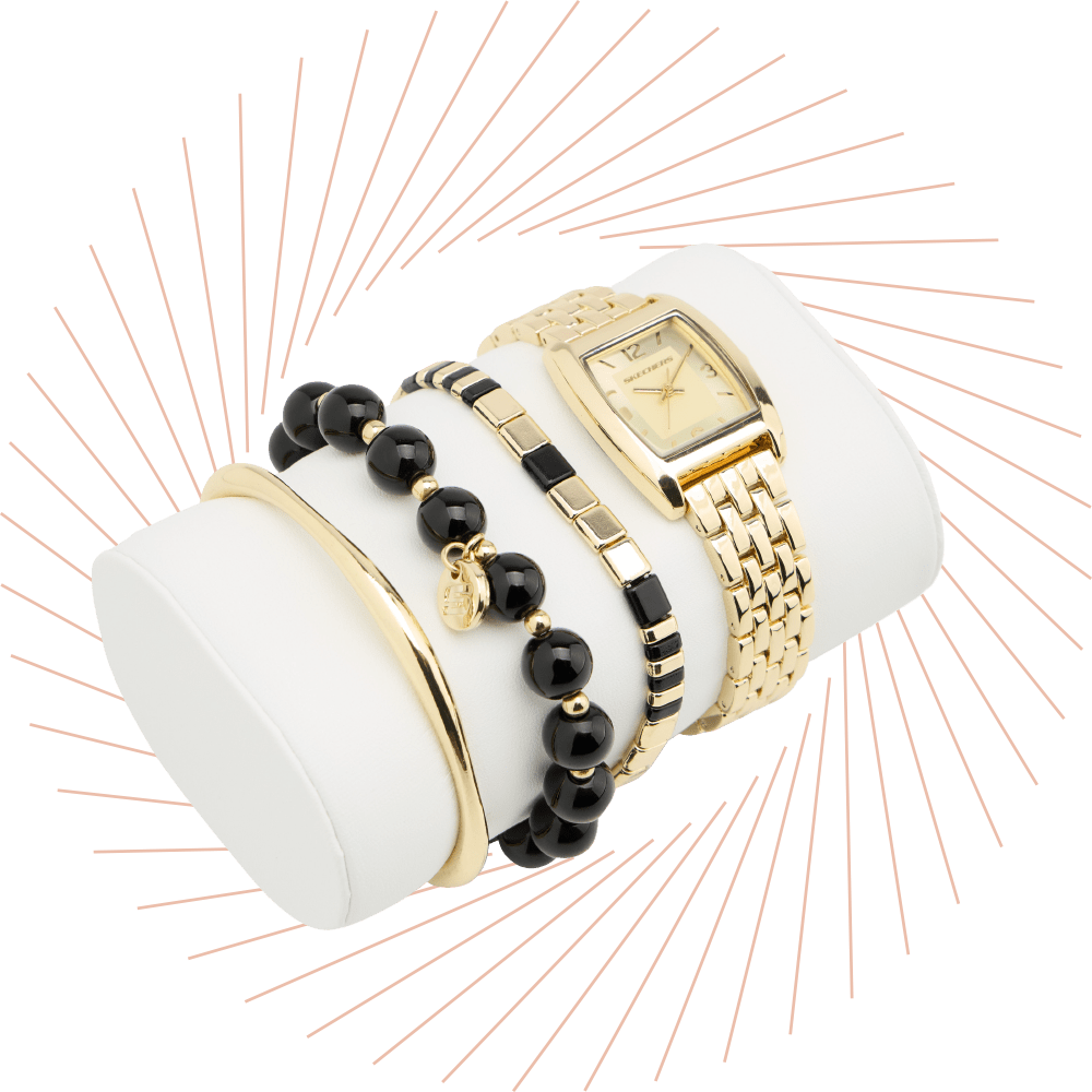 Goldene Skechers-Armbanduhr mit Armreif und schwarzen Perlenarmbändern auf Schmuckdisplay