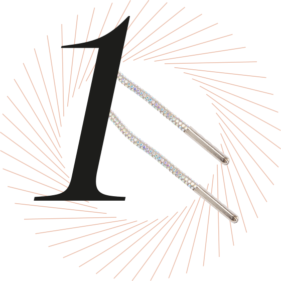 Schwarze Nummer 1 mit silbernen Glitzerschnürsenkeln vor einem strahlenförmigen Hintergrund