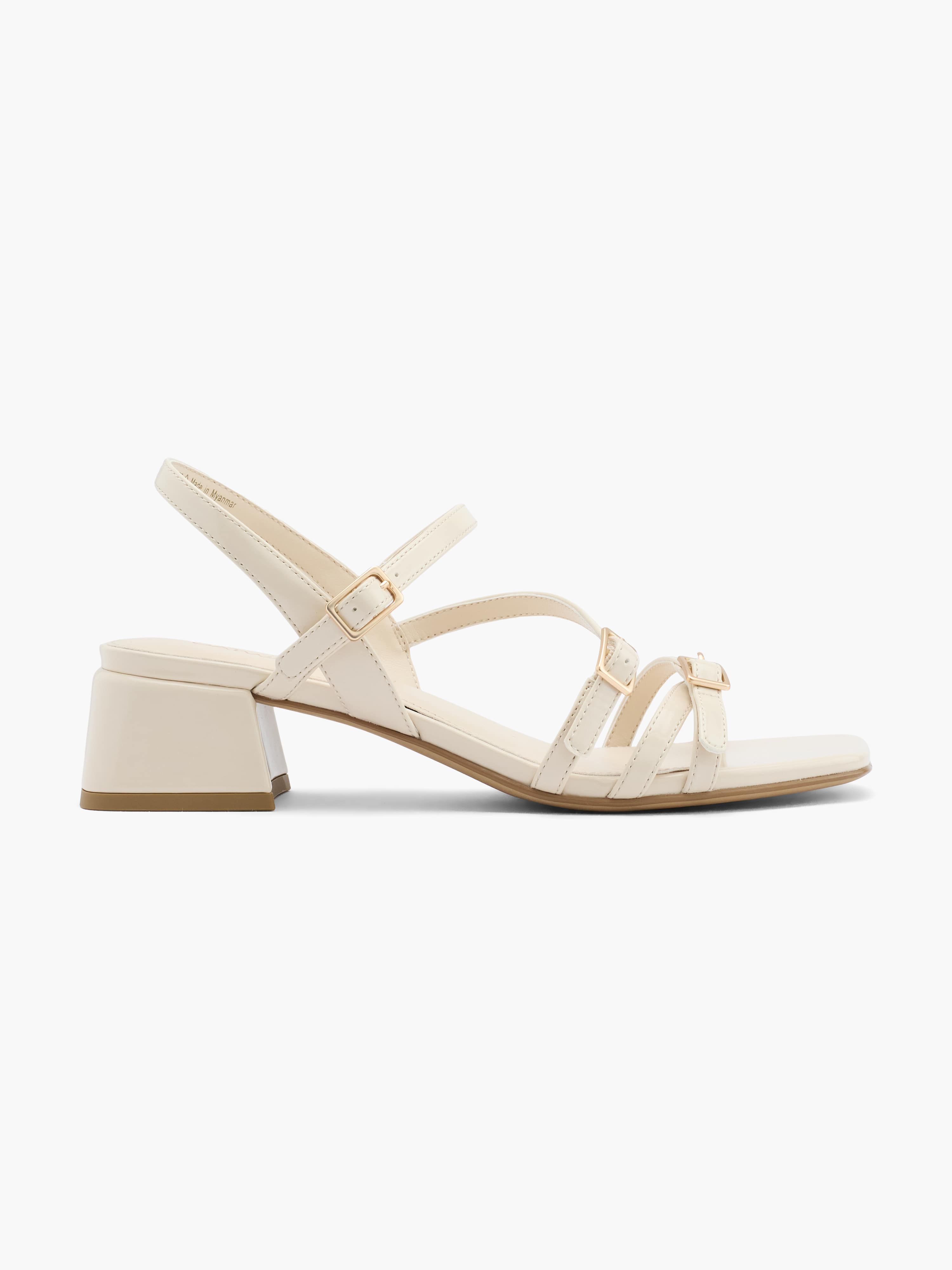 Weißer Schnallenschuh mit Keilabsatz