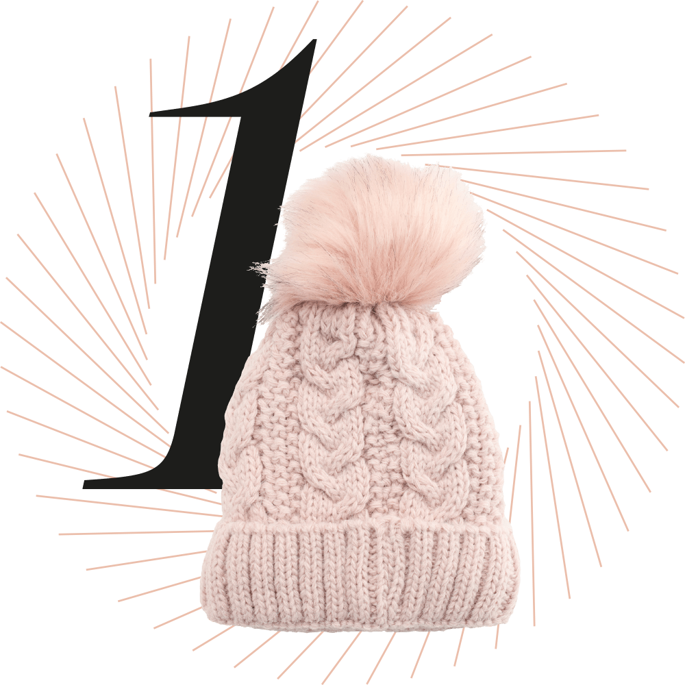 Rosafarbene Bommelmütze aus Strick, schwarze Ziffer 1 im Hintergrund