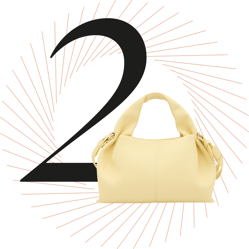 Handtasche in sanftem Sorbet-Gelb, schwarze Ziffer 2 im Hintergrund