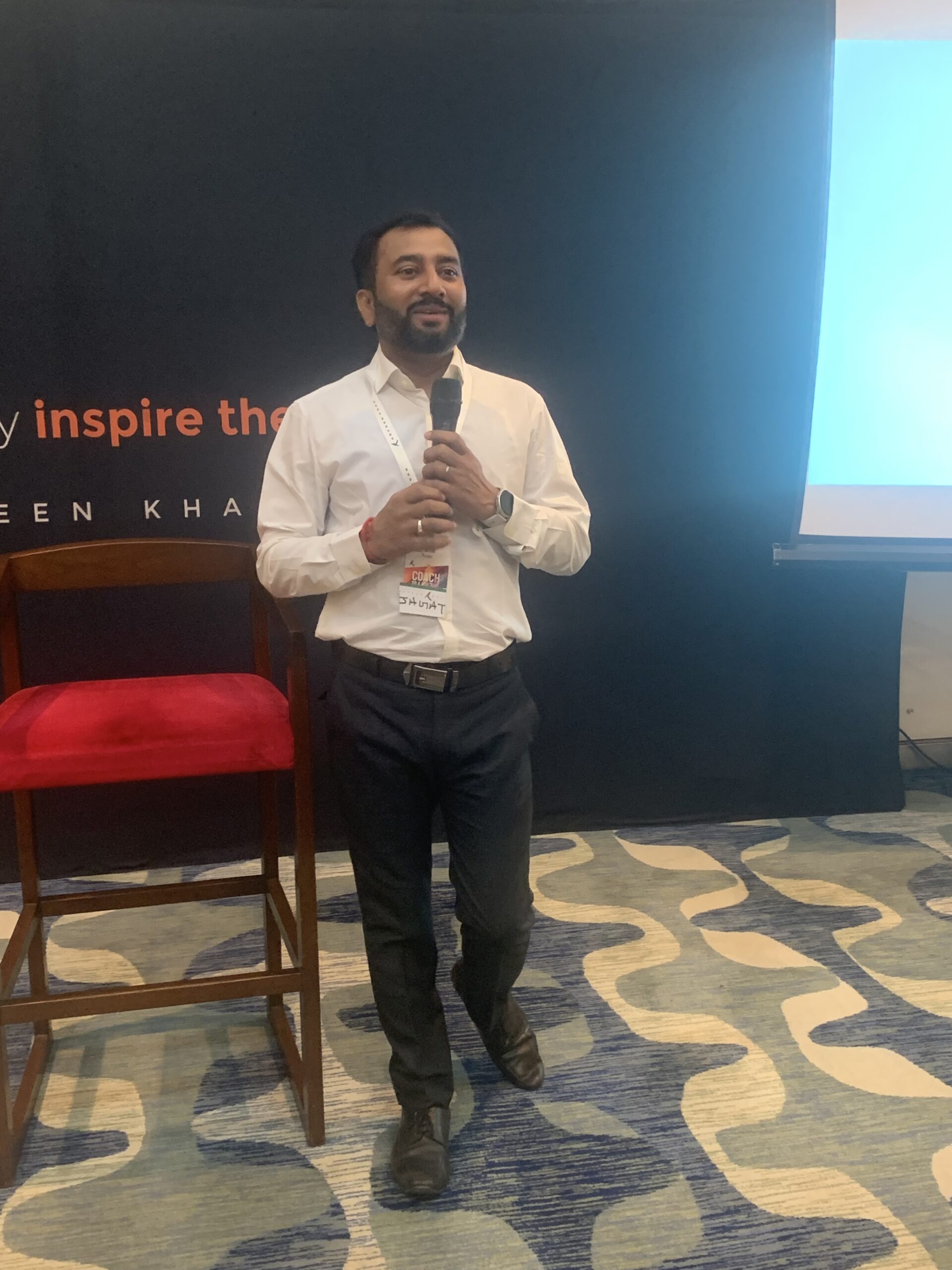 Jagat Turkiya speaking on stage