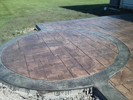 Stamped concrete patio with fire pit in Solon