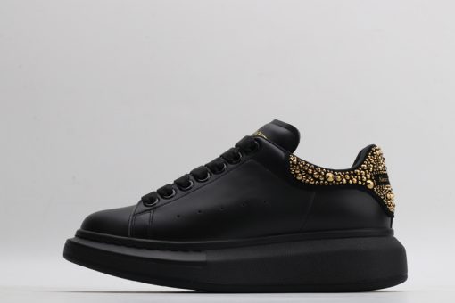 Alexander McQueen black gold tail