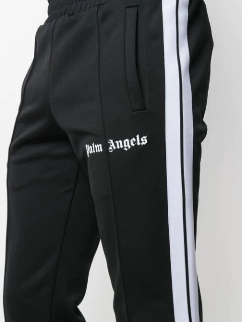 PALM ANGELS LOGO PRINT TRACK PANTS. Vertical stripes