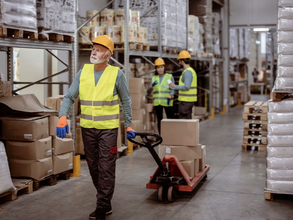 pallet jack moving boxes around a warehouse