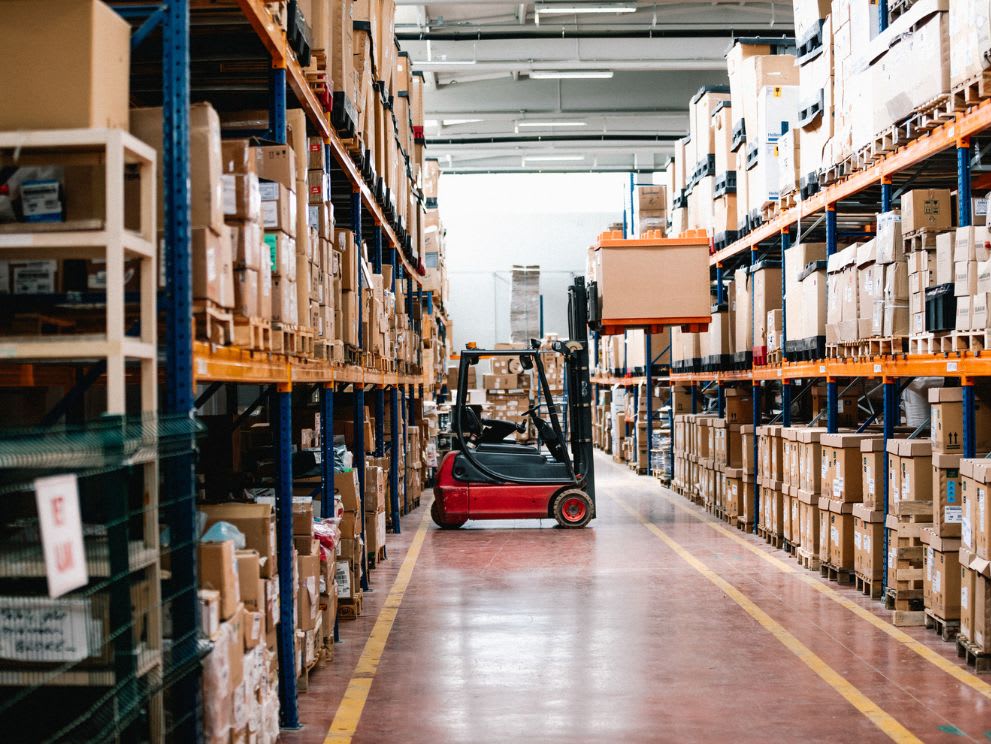 forklift loading items in a warehouse