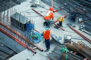 Overhead photo of construction workers on site wearing ppe