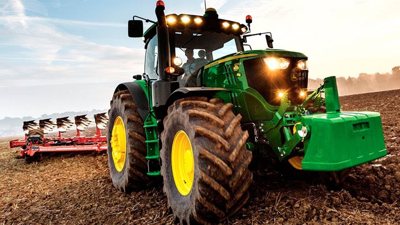 Tractor on farmers field with tiller