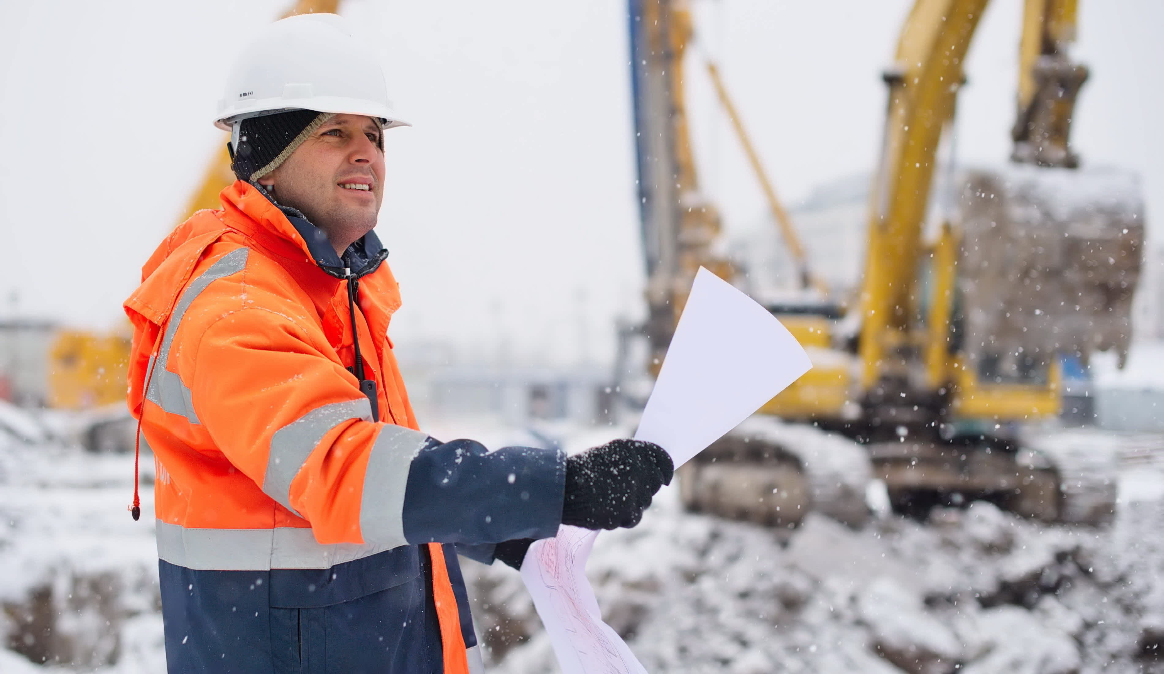 Man working construction in winter