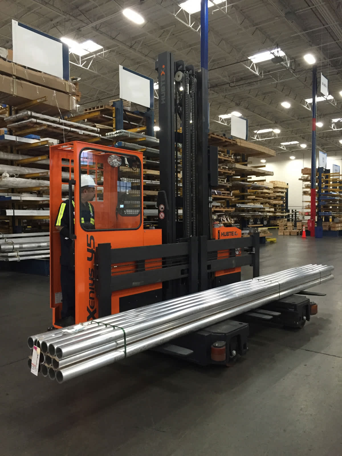 forklift in a warehouse with operator driving