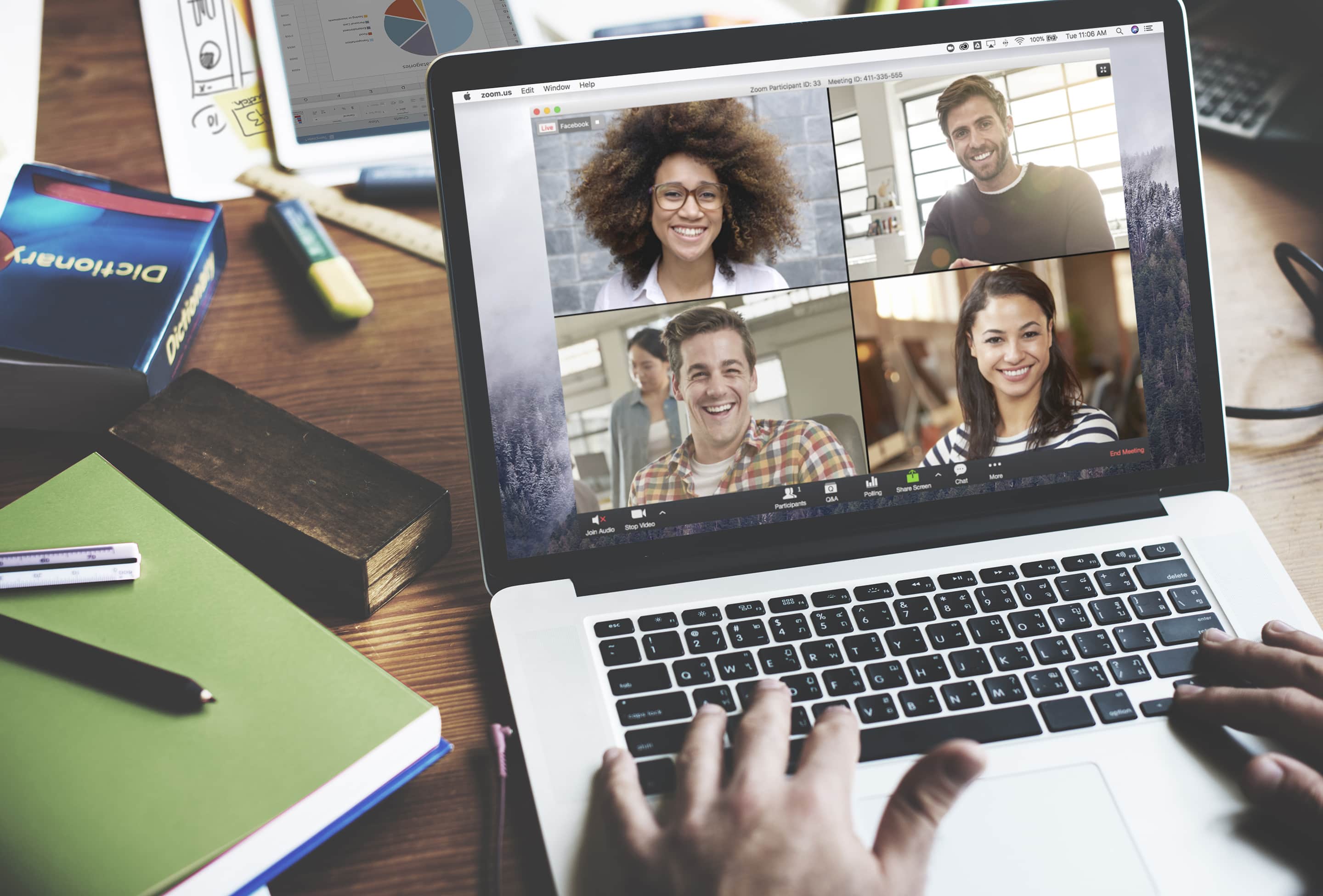 Laptop on desk with video chat showing