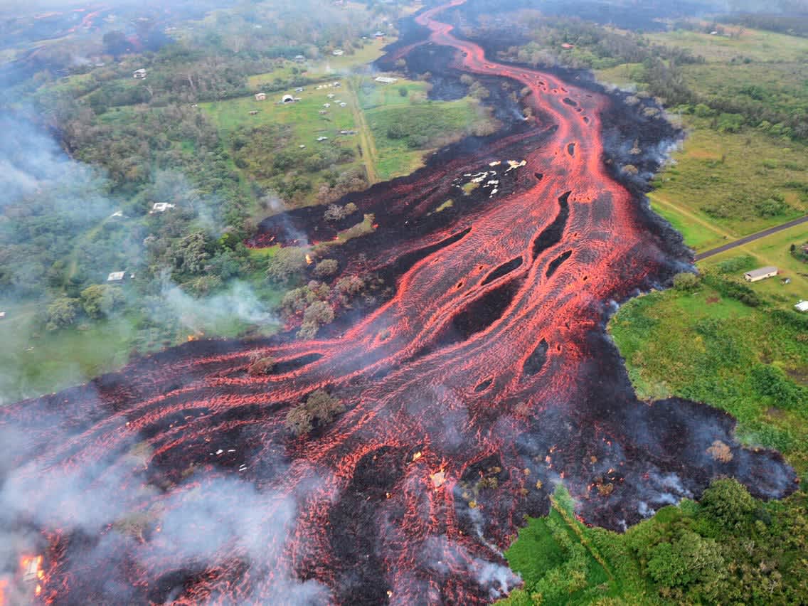 Lava flowing through greenery.