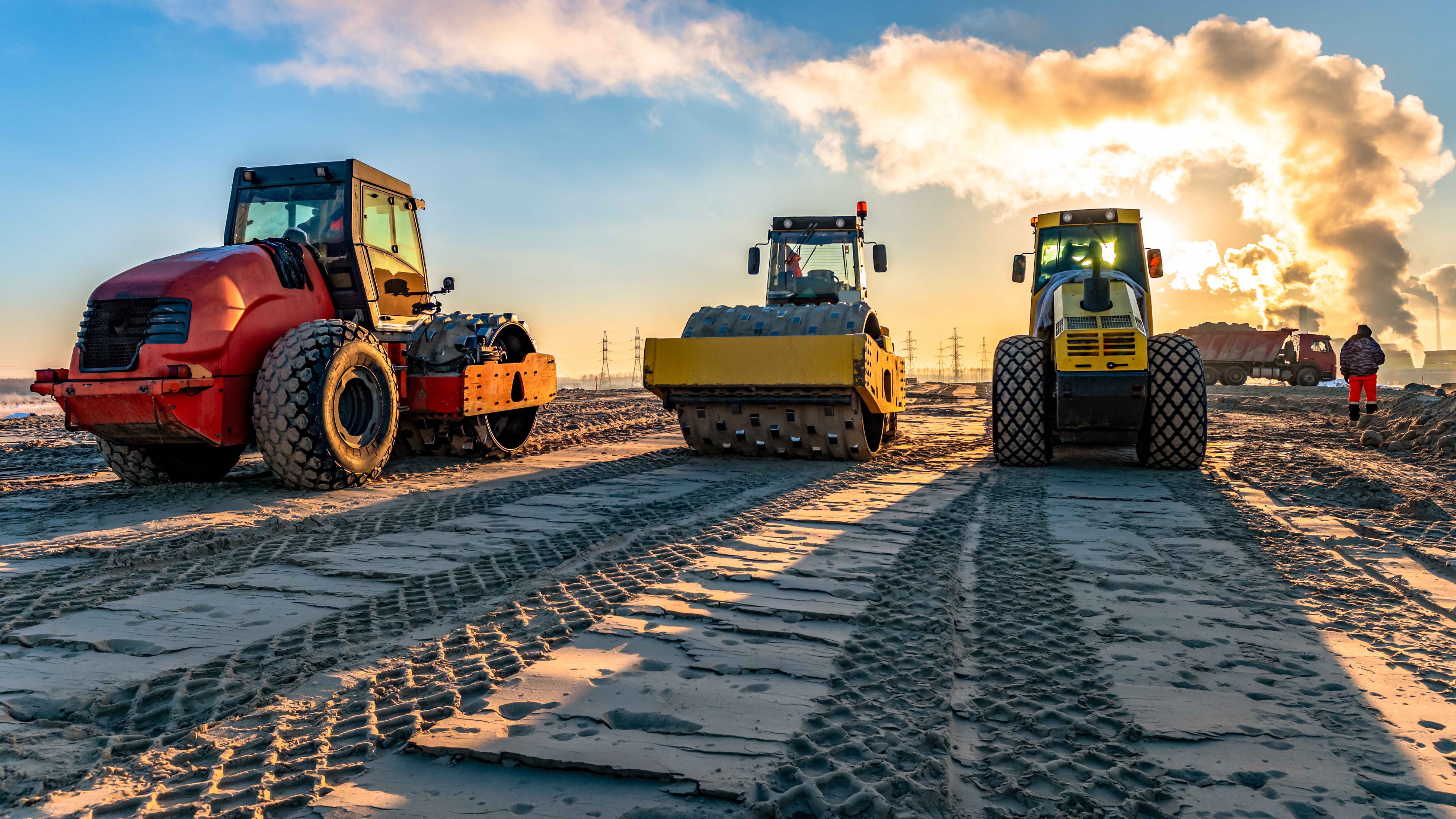 compaction machines with tire tracks in dirt