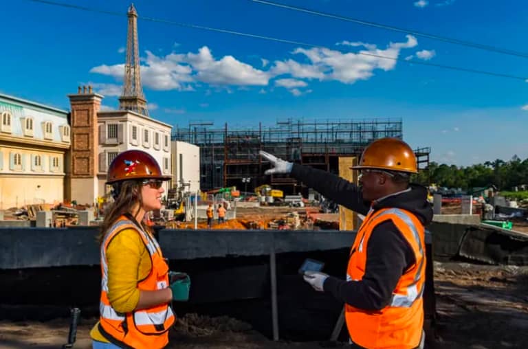 Two disney construction workers at the new EPCOT center talking