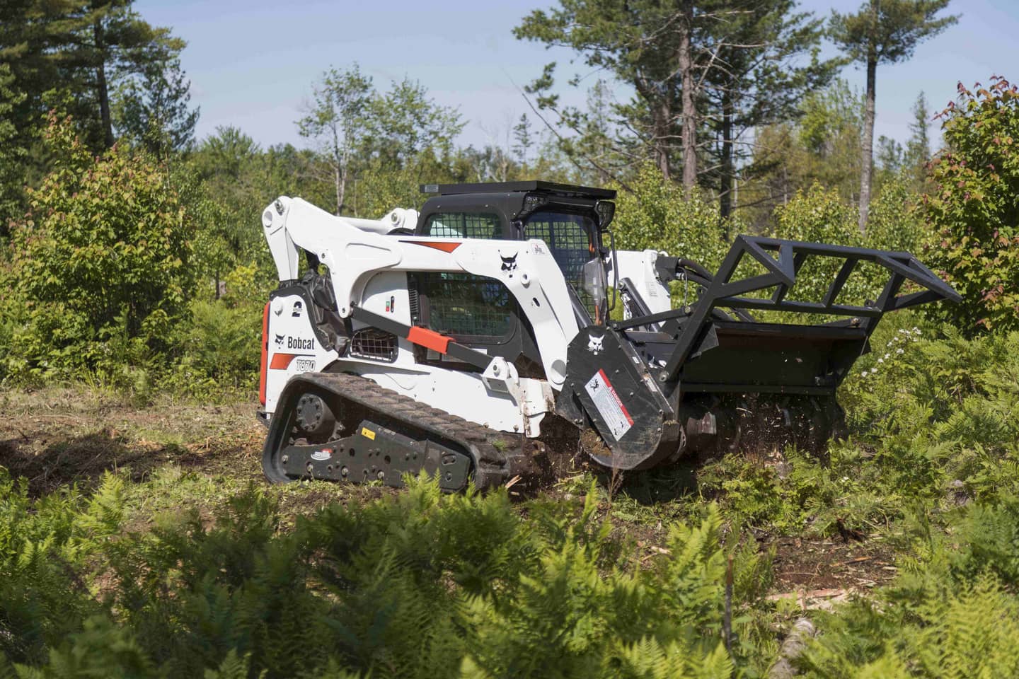 skid steer with forestry mulcher attachment