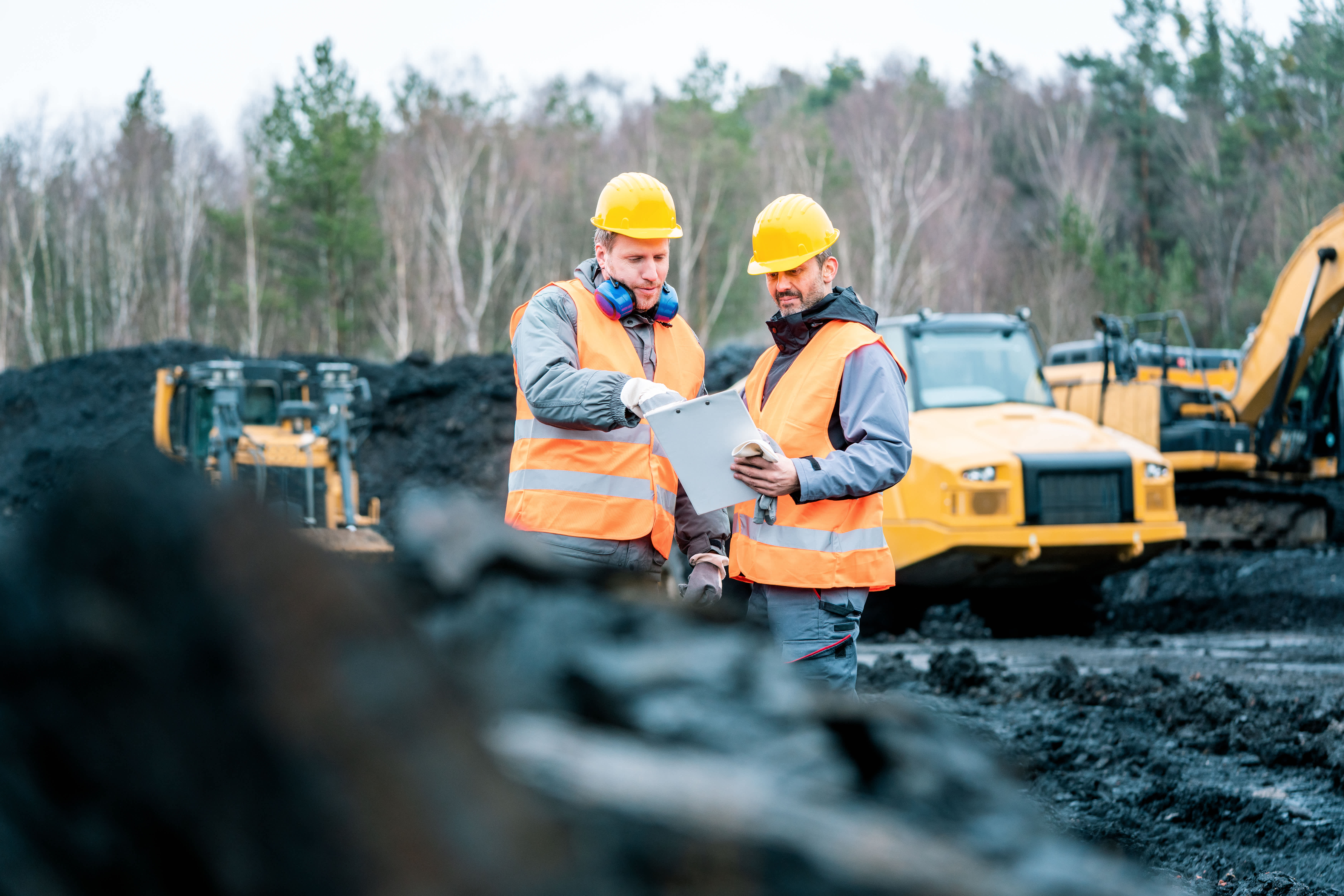 construction workers looking at BIM plans on construction site