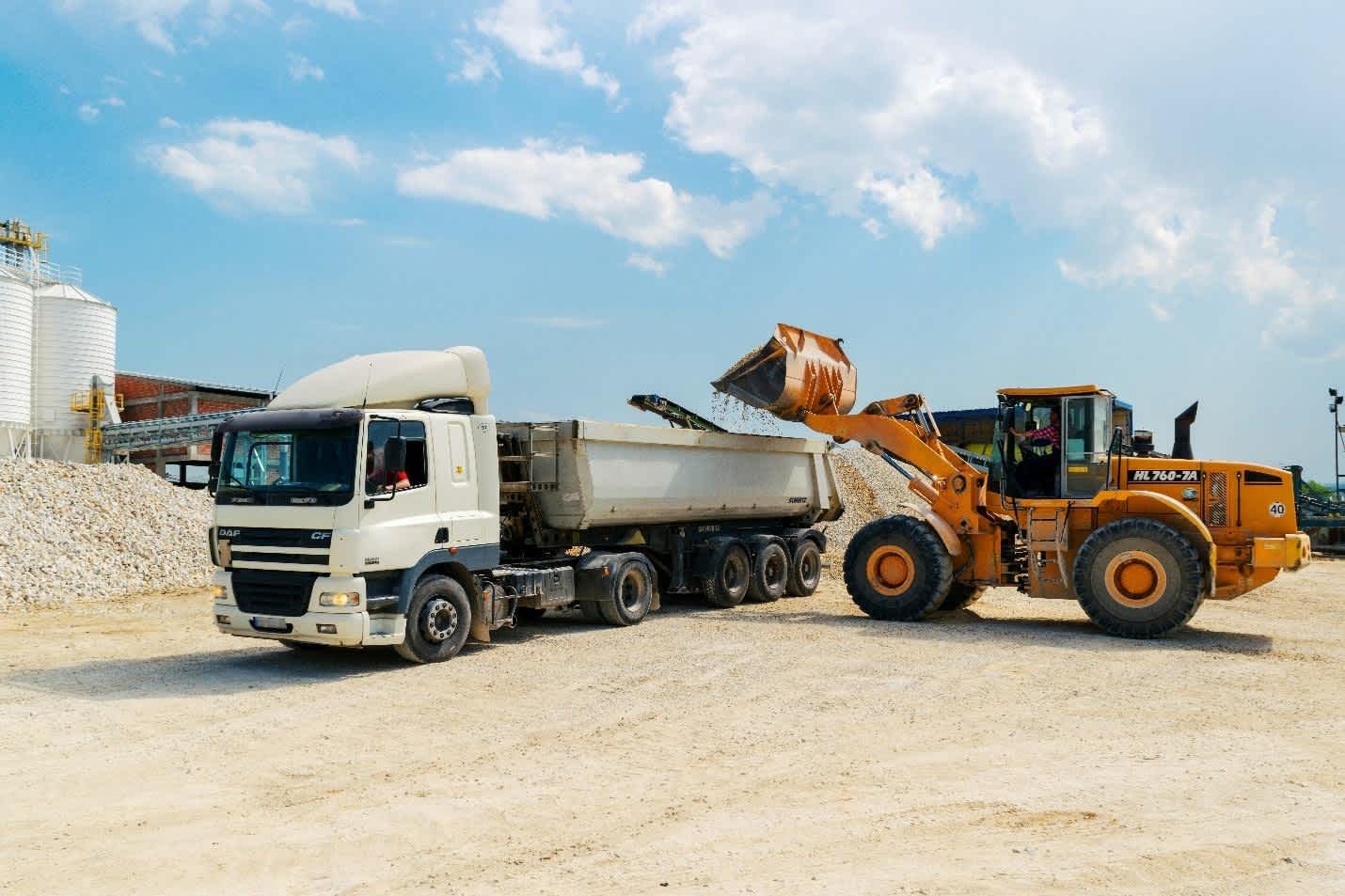 wheel loader loading material in a truck