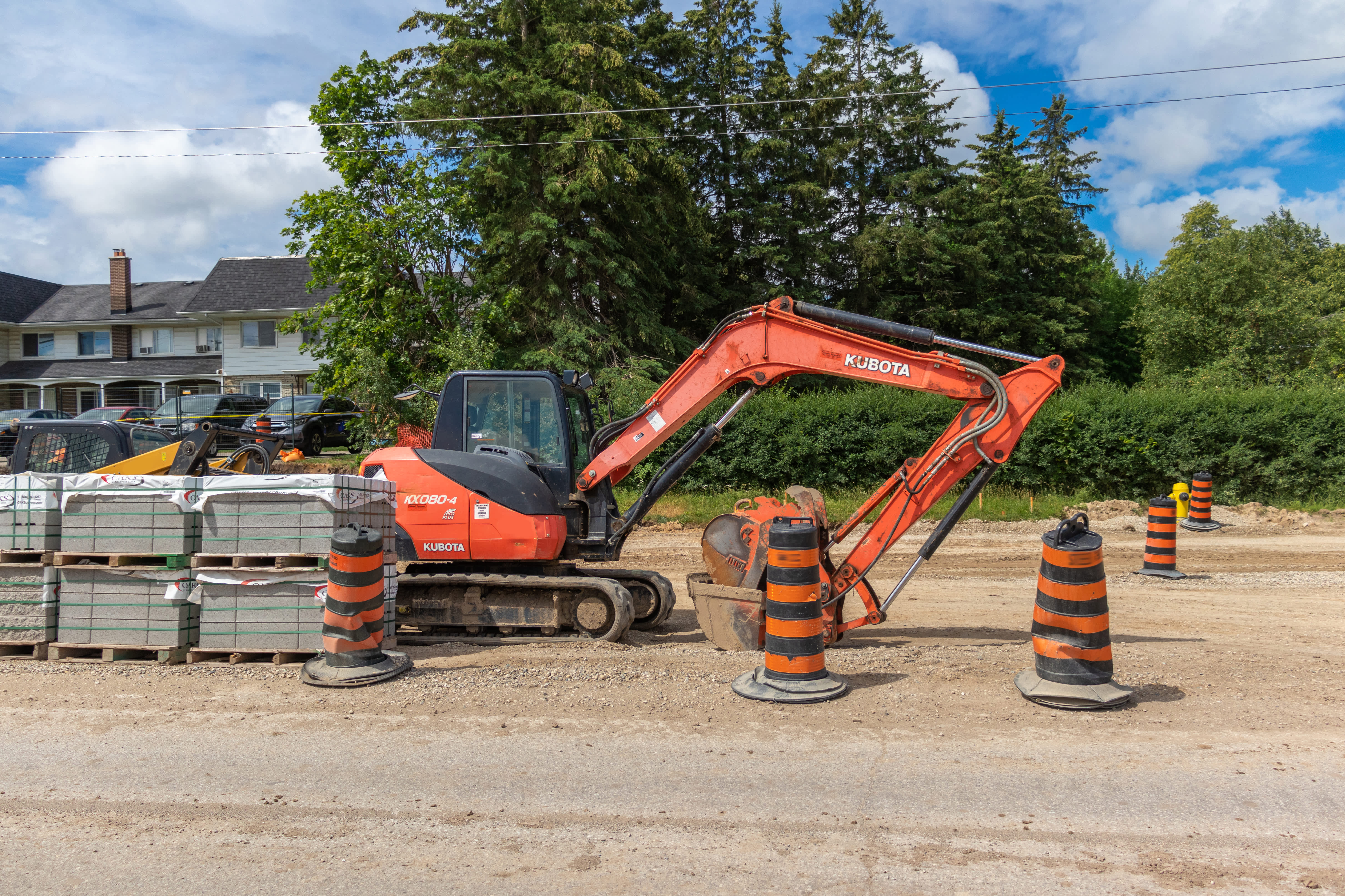 mini excavator rental parked on construction site