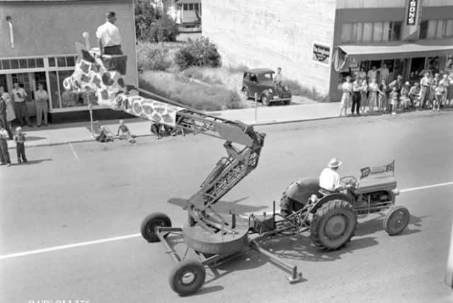 old boom lift cherry picker with a giraffe head on it