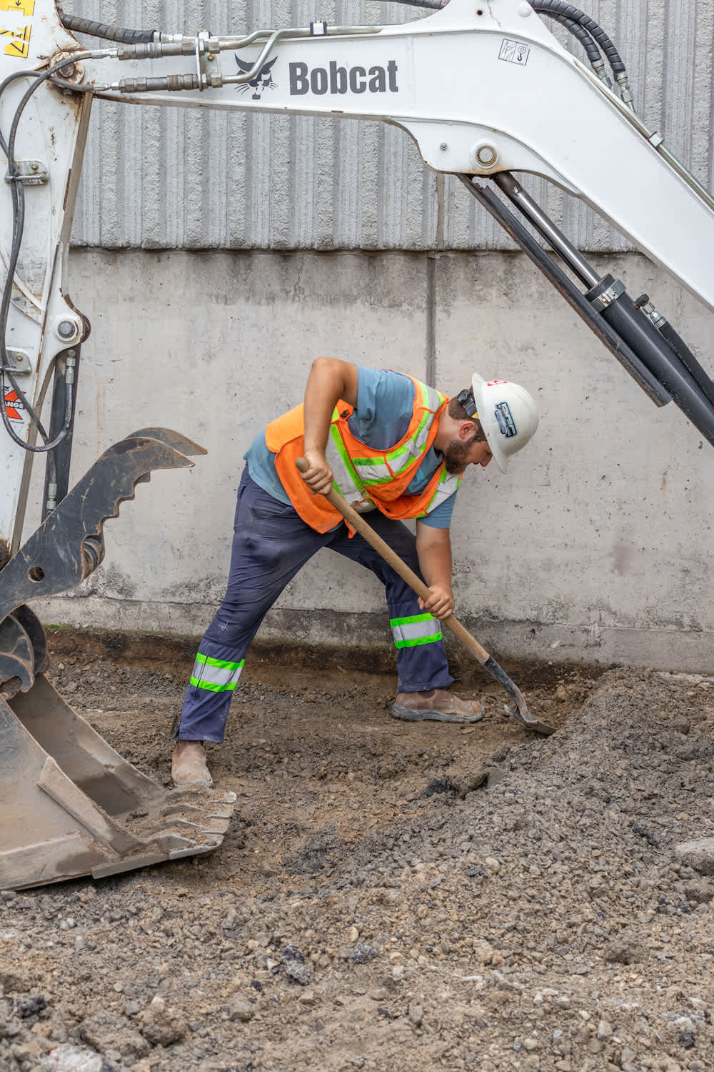 construction worker digging on construction site