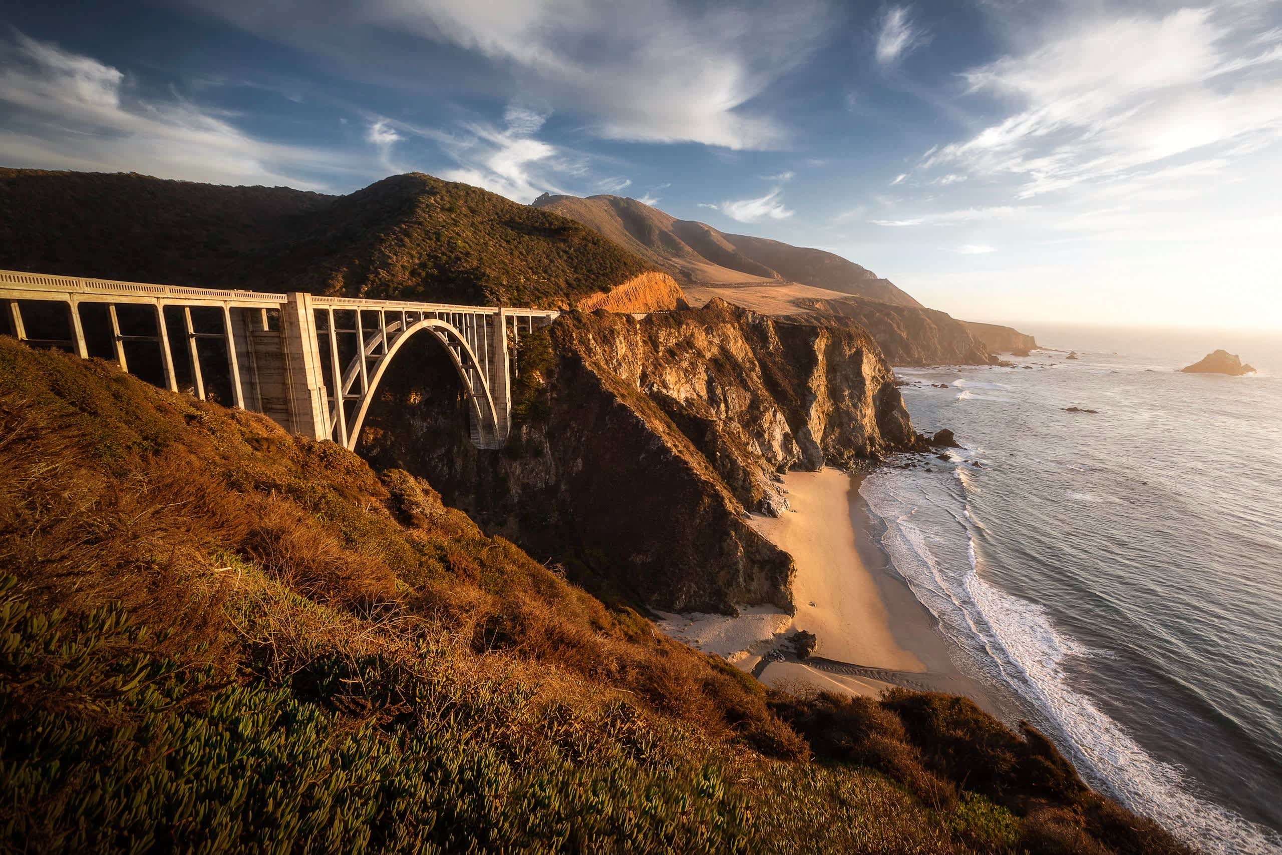 bridge over valley between mountains