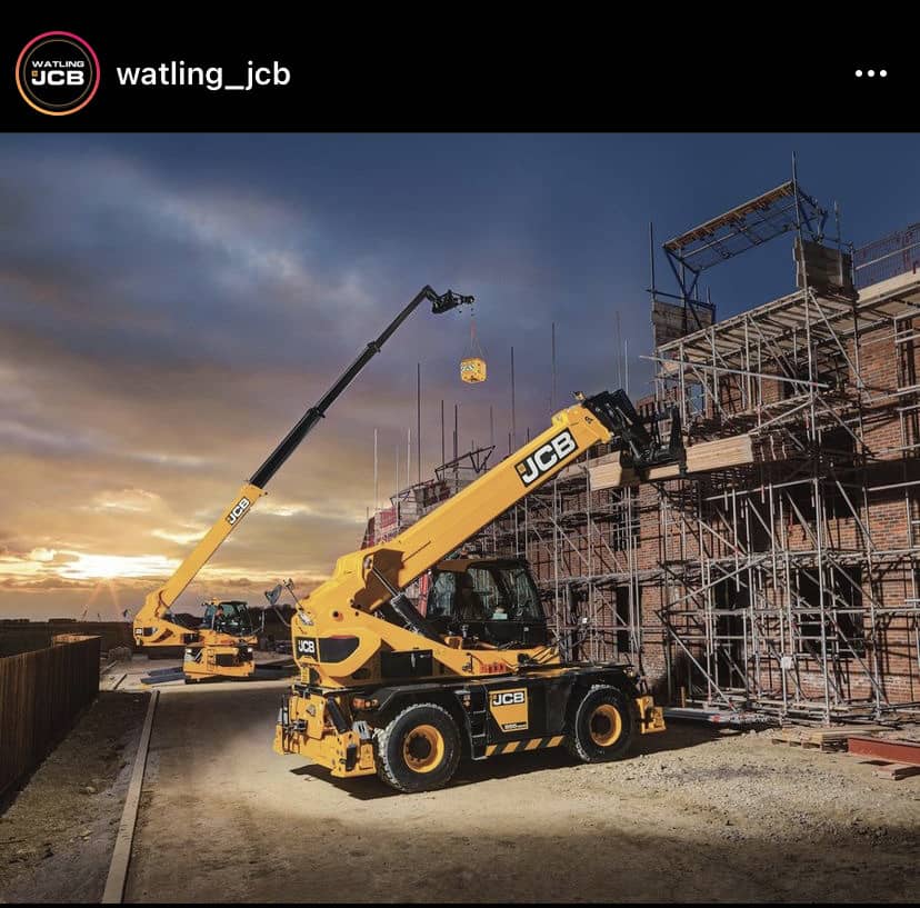 JCB telehandler on a construction site at sunset