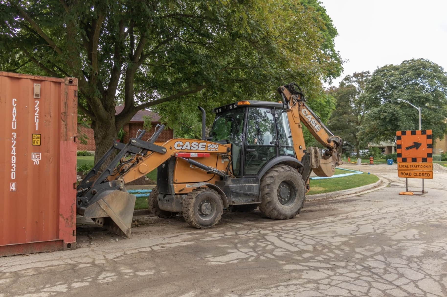 rented backhoe working on construction site