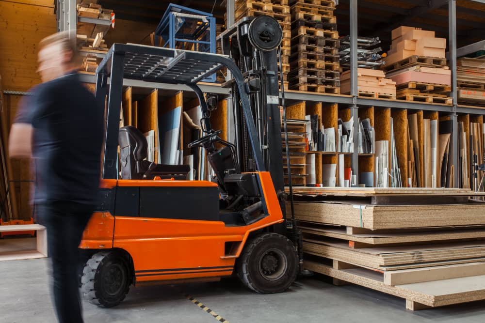 forklift operating lifting pallet of merchandise