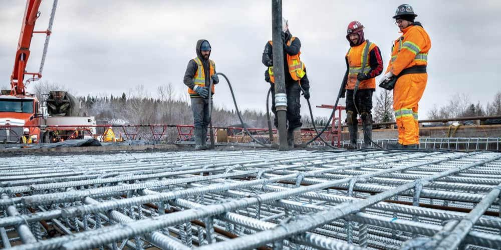 concreting a bridge slab using a concrete pump during the winder. Rebar. 