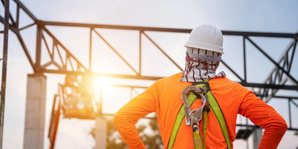 Worker looking up at unsafe work