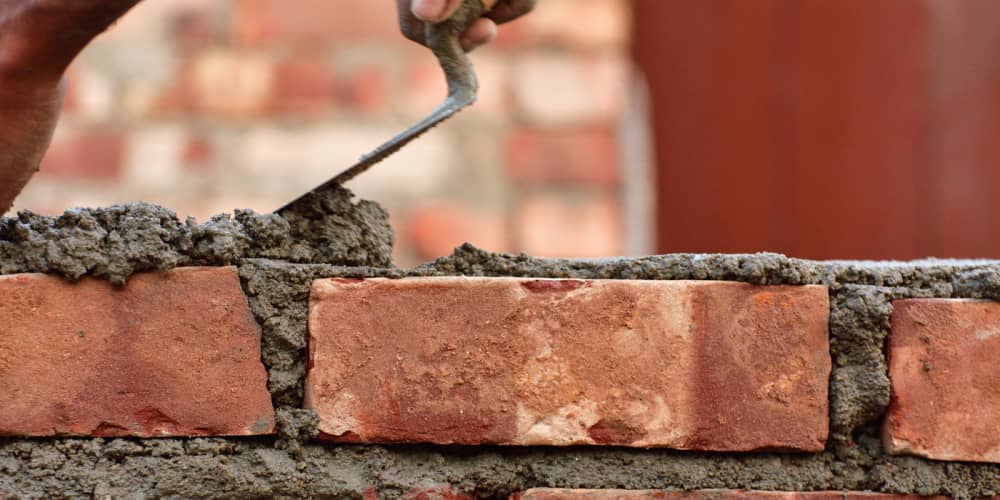 Worker bricklaying