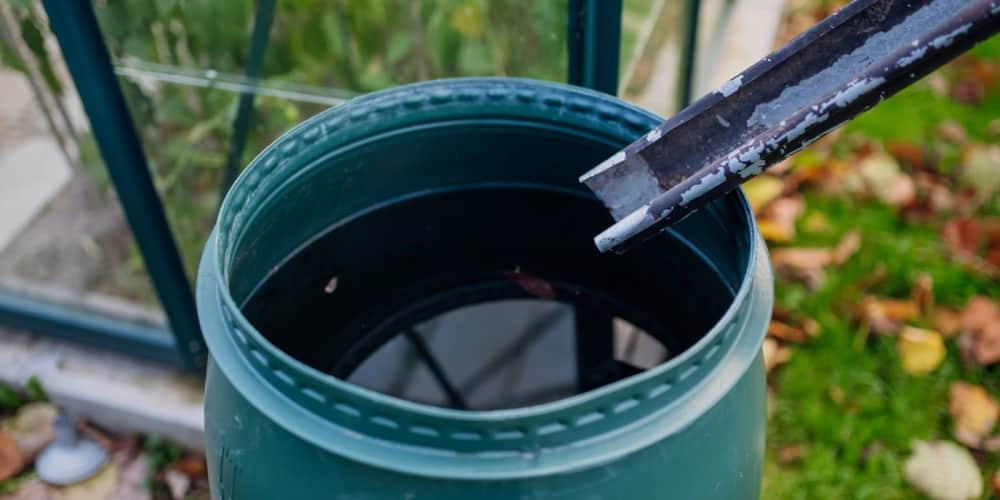 Rainwater harvesting system directing water into a barrel using a downspout