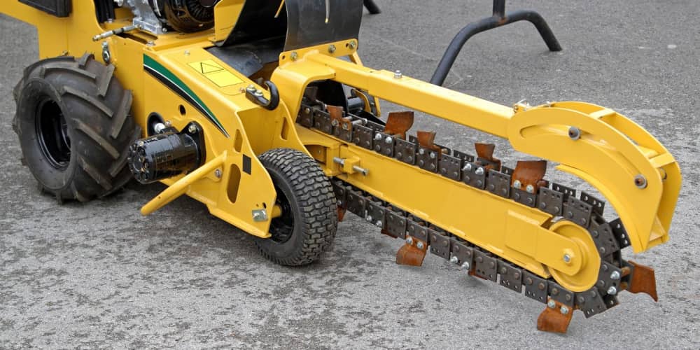 Walk-behind trencher with a chain attachment