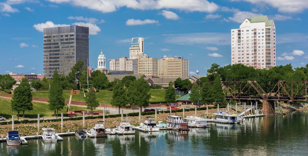 Augusta Georgia skyline with boats and river in the foreground