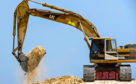 Excavator digging dirt