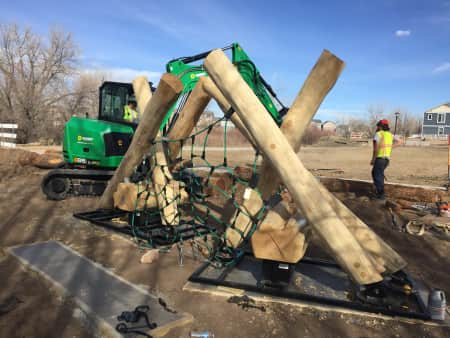 Mini Excavator moving wood structures