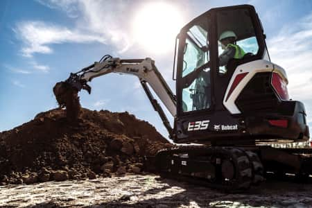 Mini Excavator digging dirt