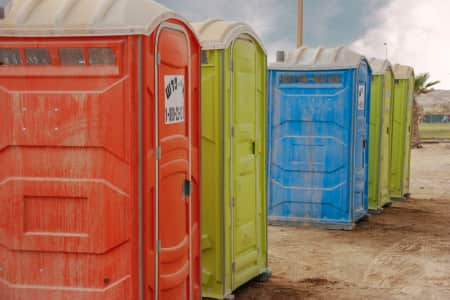 Porta Potties in a line on a cocnstruction site